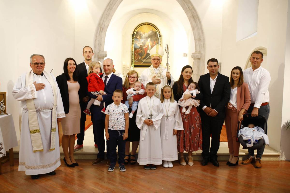 Proslava sv. Augustina i krštenje petog djeteta roditelja Stožicki u Velikoj
